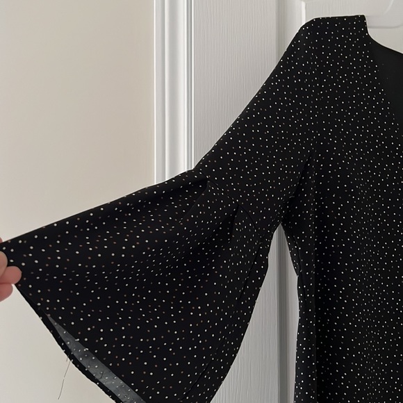 Black colour blouse with white and brown tiny dots are there on it . - Picture 2 of 4